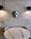 Custom 3D light-up business logo sign glowing on wall — made in Canada by TOJ Designs